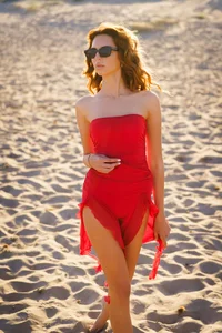 SophieArya Crimson Seduction by the Shore Pic