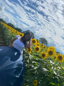 MatureHornyxxx A goodess between sunflowers Pic 3